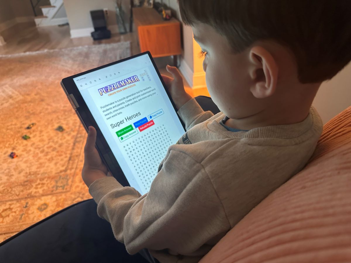 young child looking at free online word search puzzles