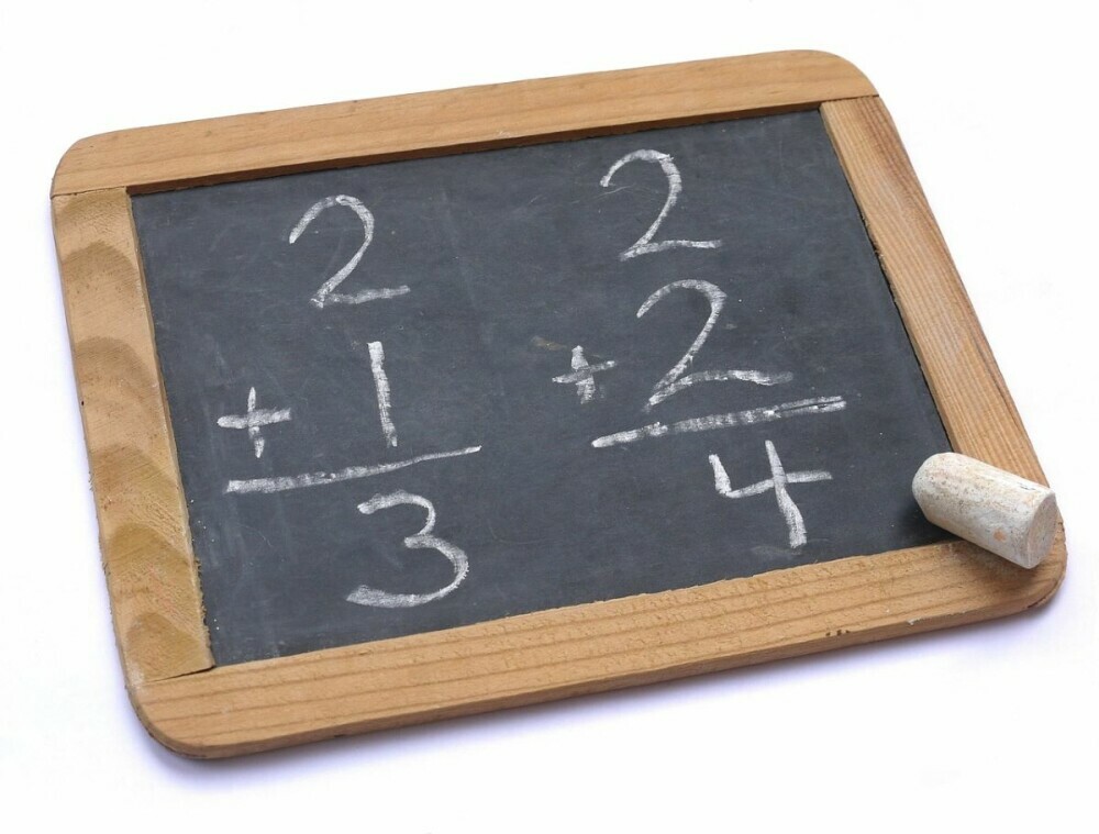 Picture of basic blackboard with simple addition problems. Fun math puzzles kids could provide more learning tools.