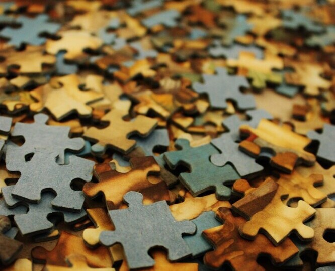 Miscellaneous jigsaw puzzle pieces to represent best rated jigsaw puzzles for seniors