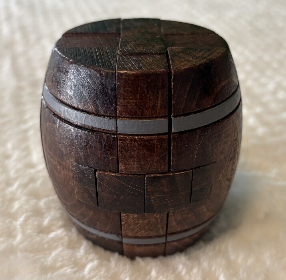 Close up of wooden barrel puzzle fully assembled